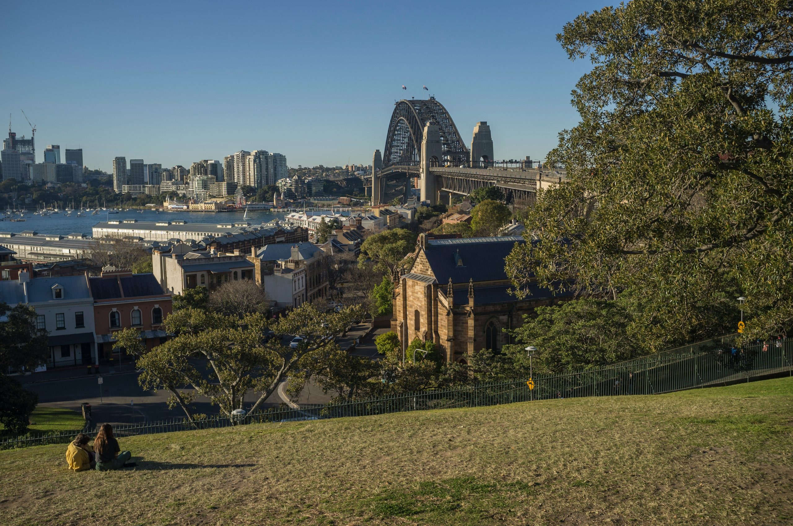 Skyline view from a park overlooking the Sydney Harbour Bridge